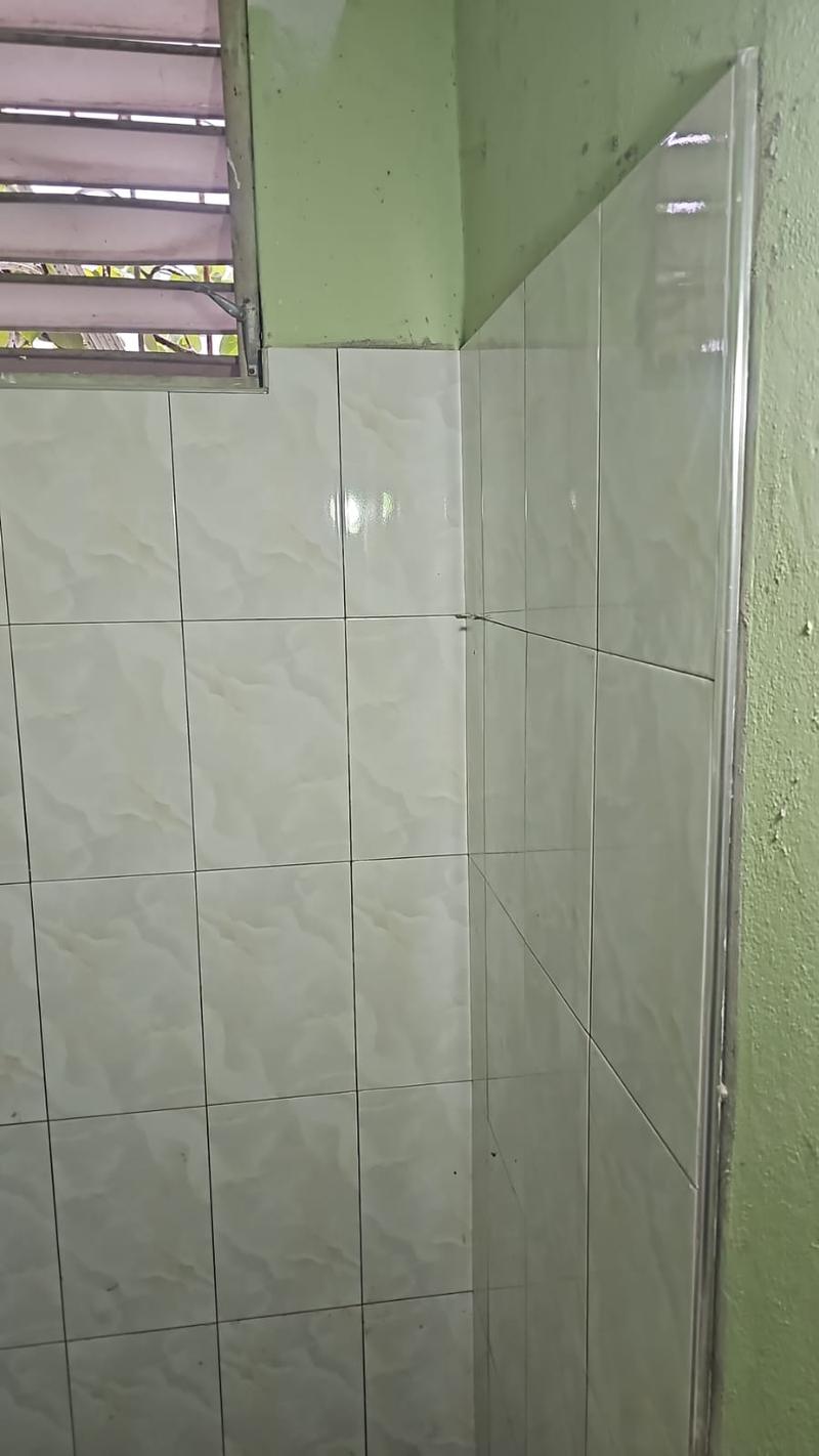 Bathroom wall tiling with protective edge