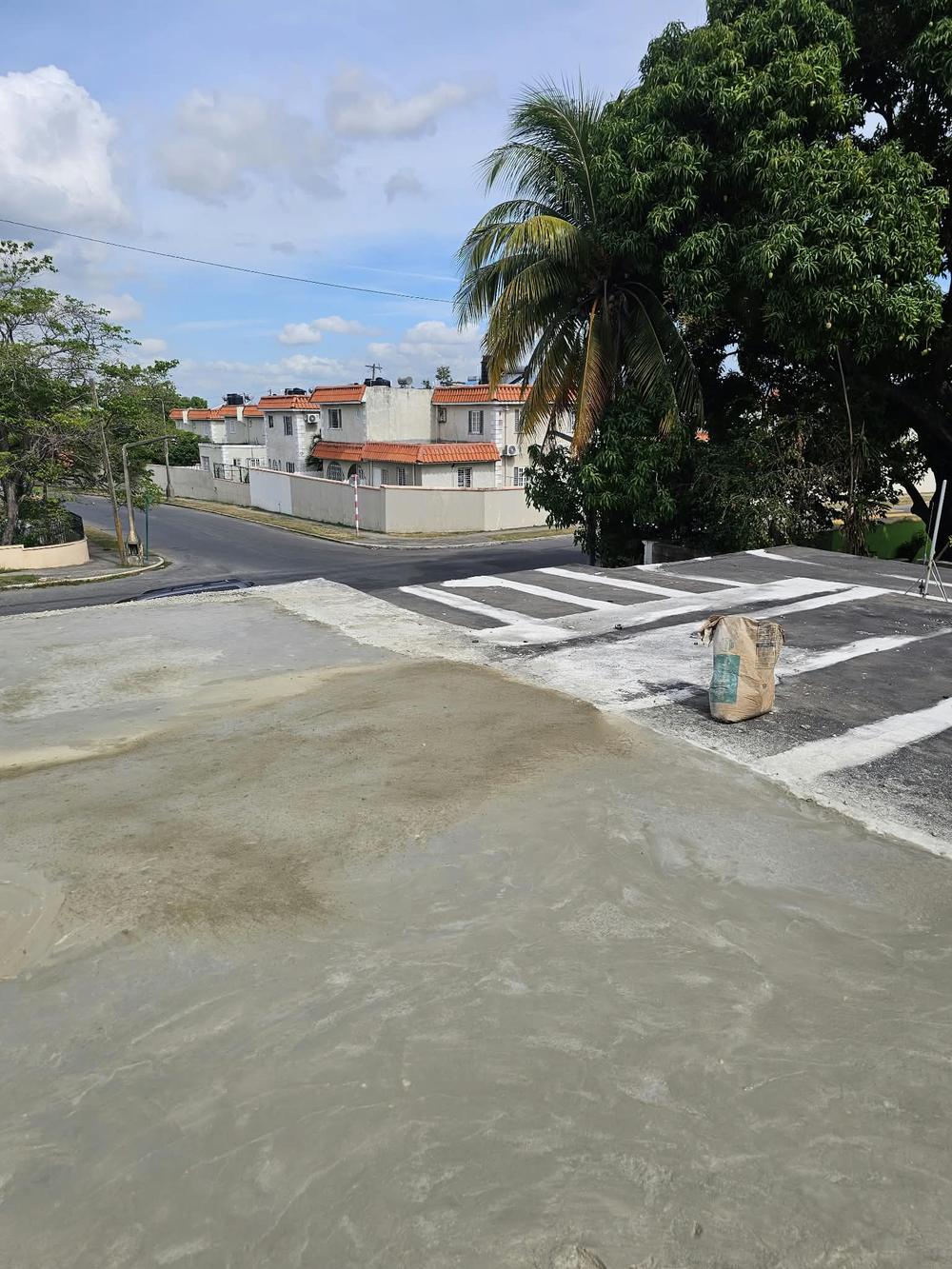 Newly poured concrete roof slab overlooking the neighbourhood