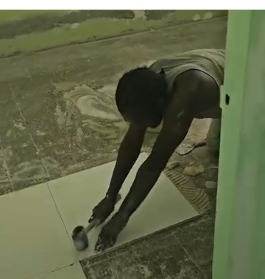 Floor tiling in progress